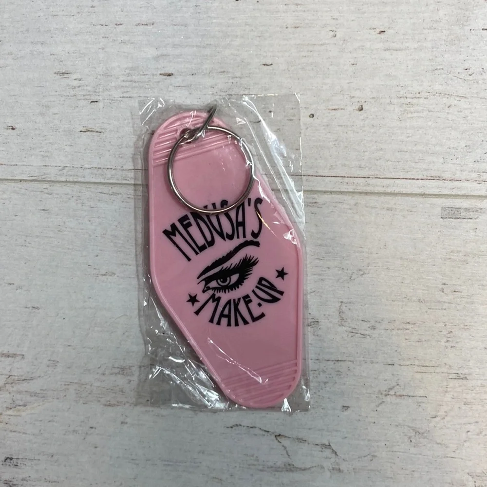 Medusa’s Makeup Light Pink “Escape the Ordinary” Hotel Room Key Chain